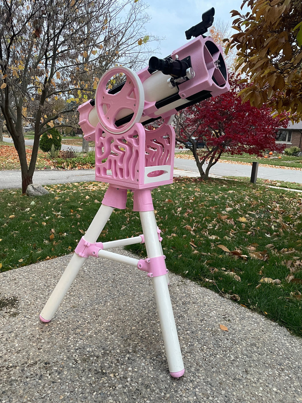 Pink and white Skyward 150 telescope outdoors