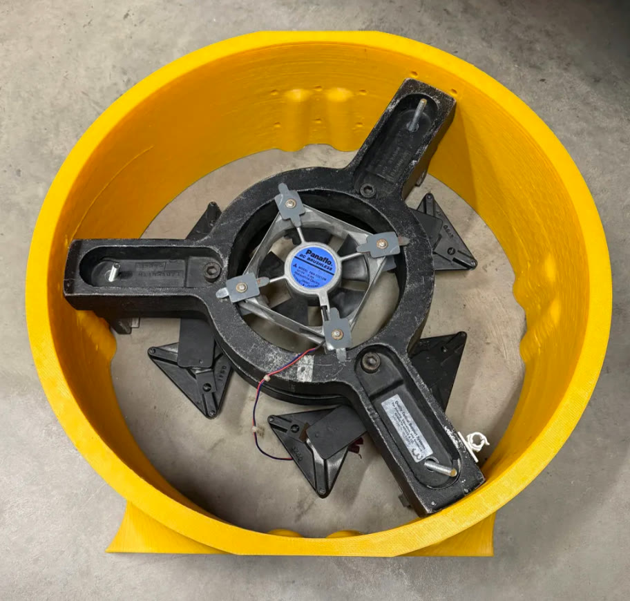 Large yellow printed telescope section with the mirror cell test-fitted inside